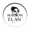 A woman with stylish sunglasses and makeup, representing Maison Elan fashion brand.